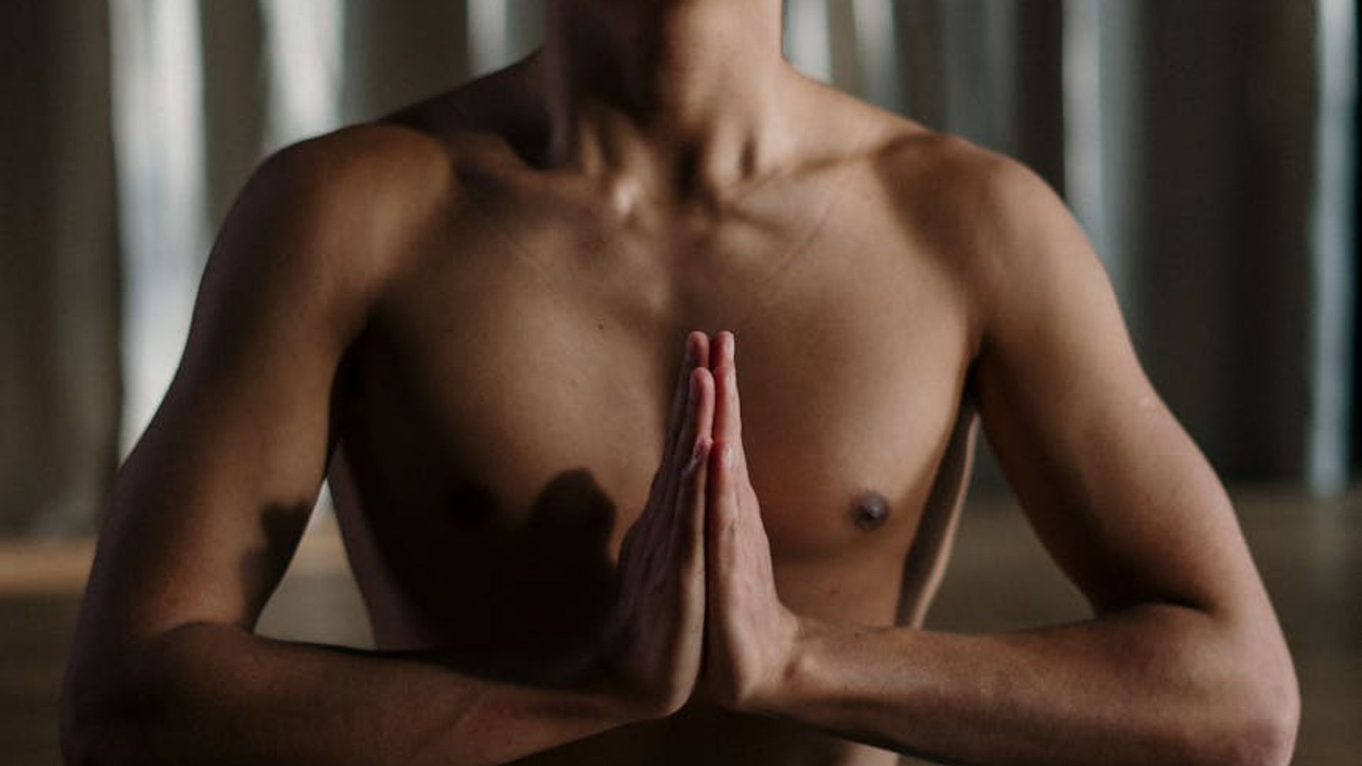 A calm and minimalist space for yoga practice with soft natural light.